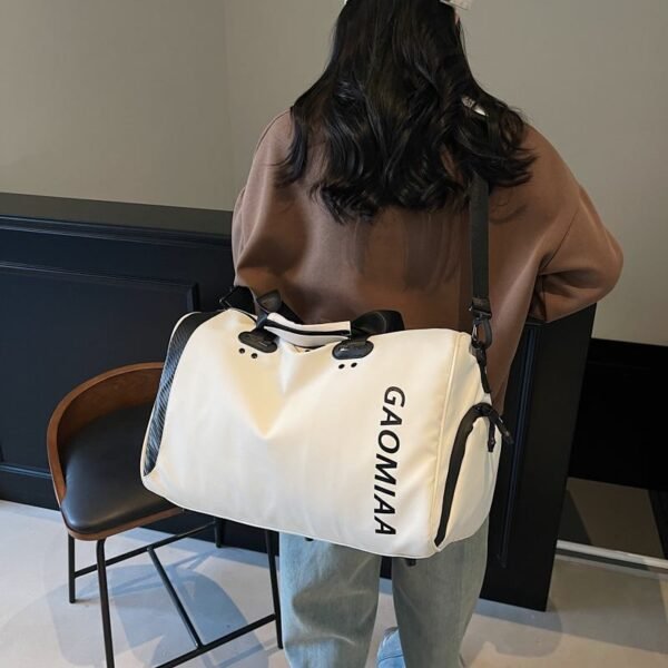 Gym and travel duffel bag with a separate compartment for wet items