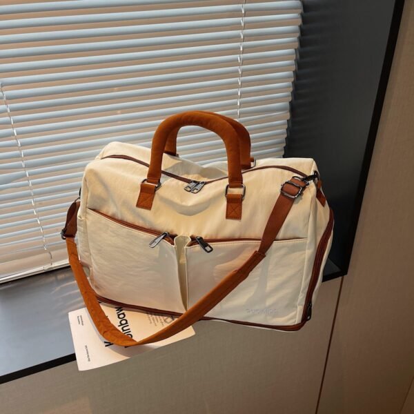 Lightweight, waterproof sports tote bag with multiple compartments