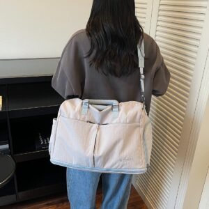 Lightweight, waterproof sports tote bag with multiple compartments