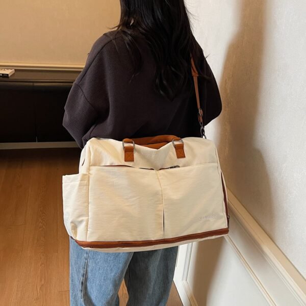 Lightweight, waterproof sports tote bag with multiple compartments